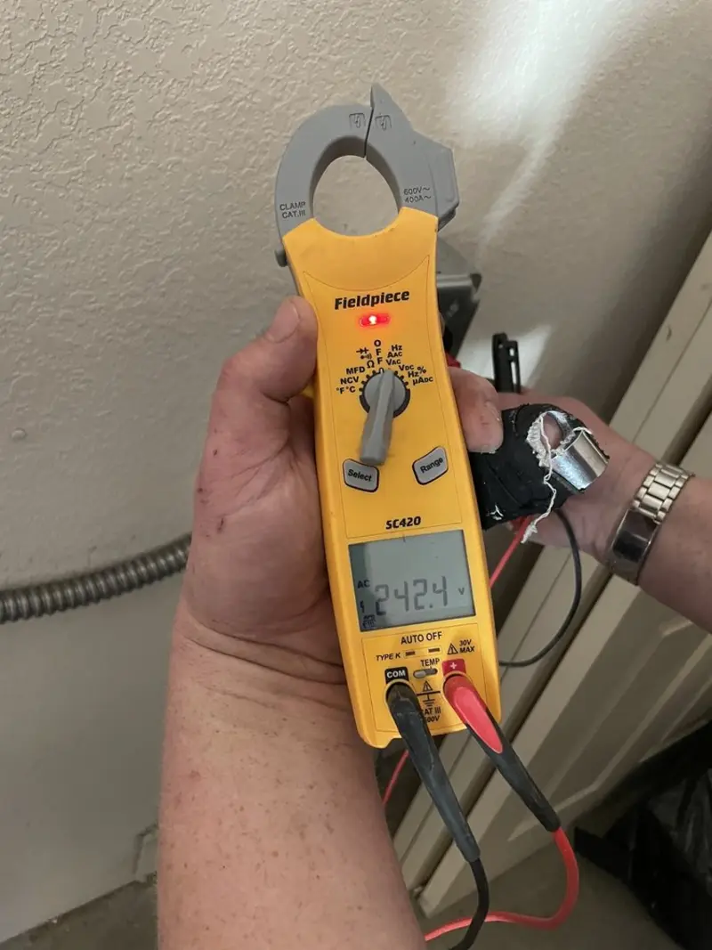 Voltage testing with clamp meter during Electrical Installation Services in Oneonta